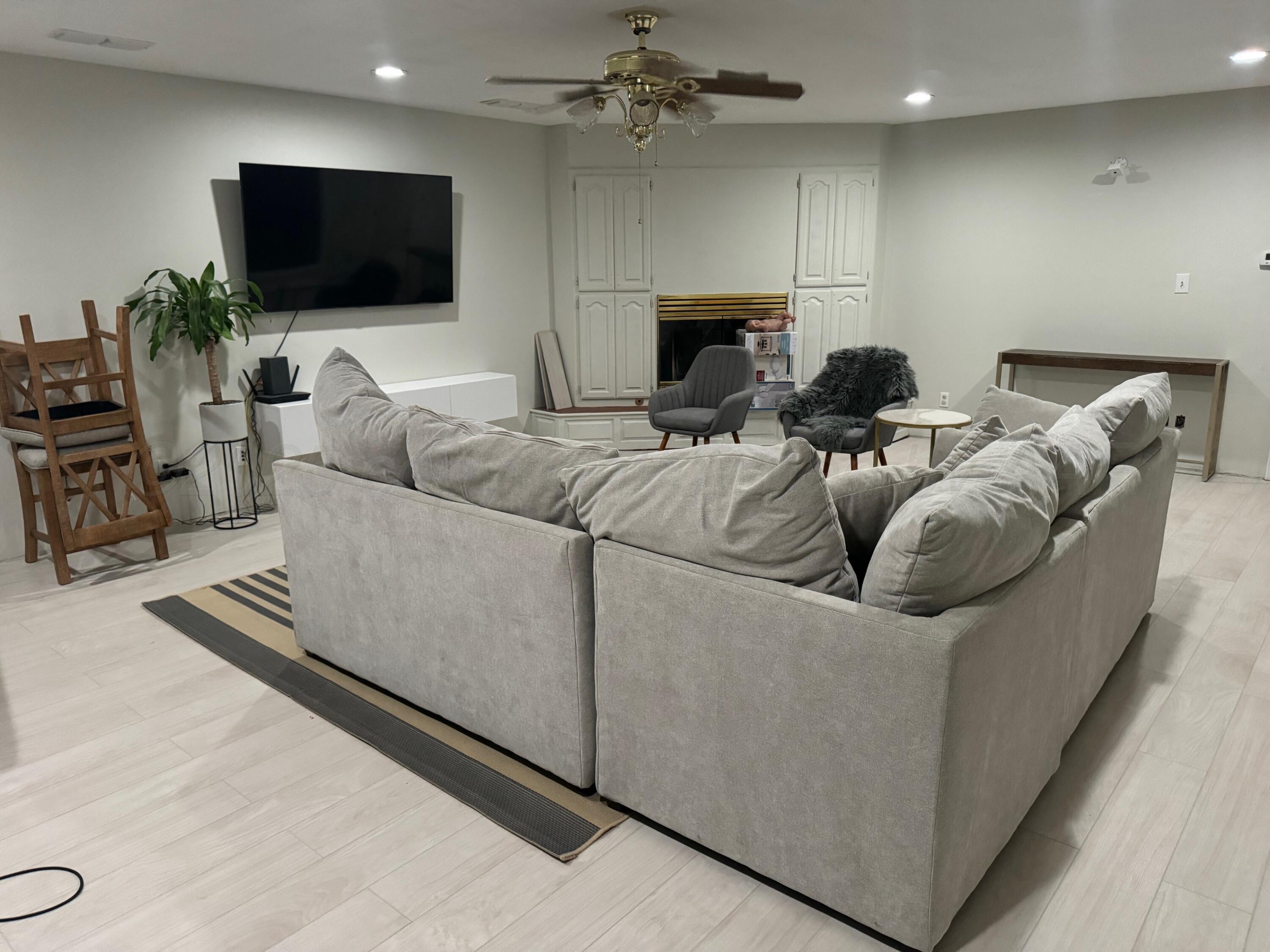 513 South Eton Street Perryton, TX 79070 - Photo 25 of 72 a living room with furniture and a flat screen tv