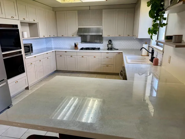 a spacious bathroom with a toilet and a shower