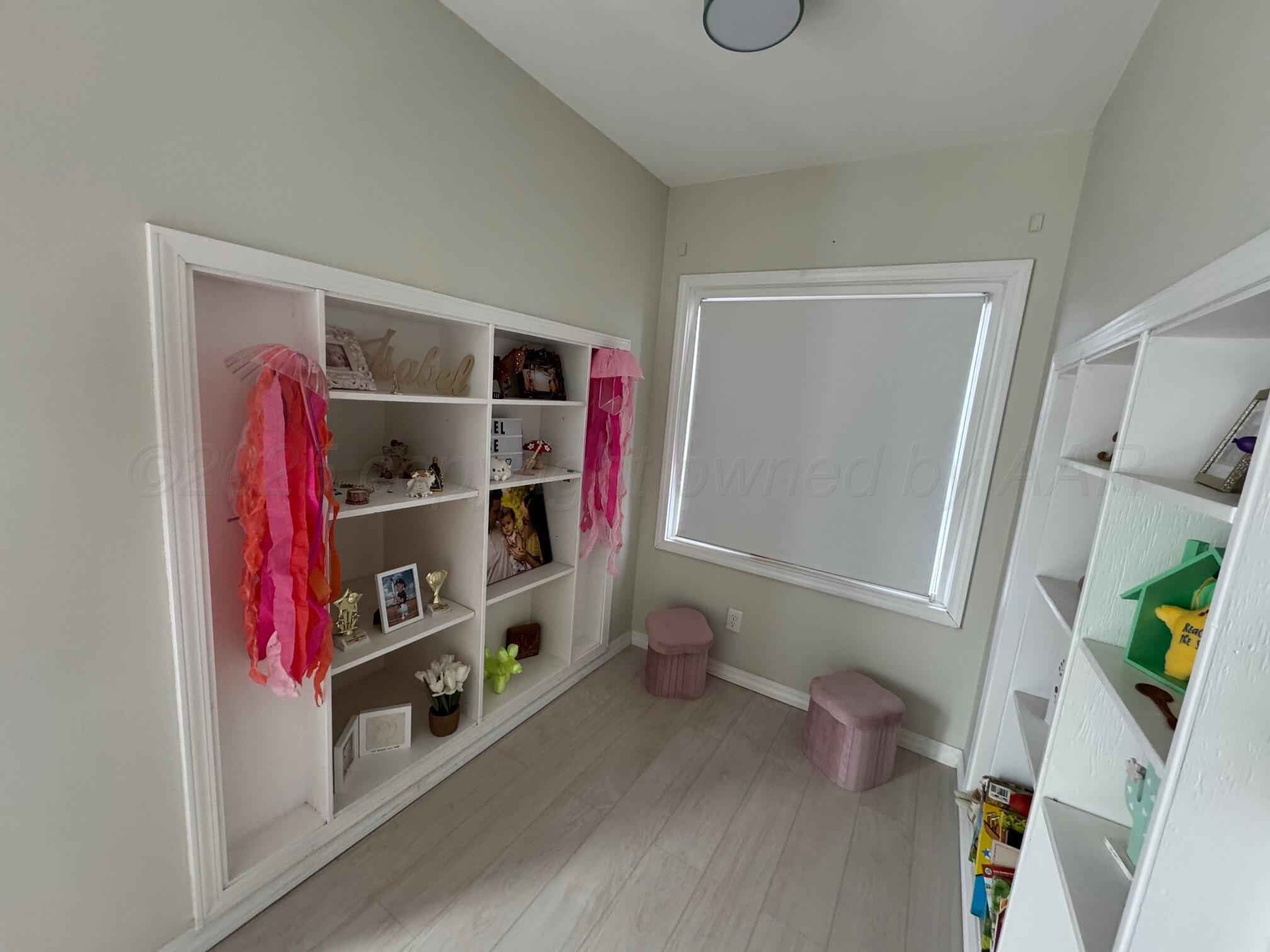 513 South Eton Street Perryton, TX 79070 - Photo 48 of 72 a view of walk in closet with clothes and shoes