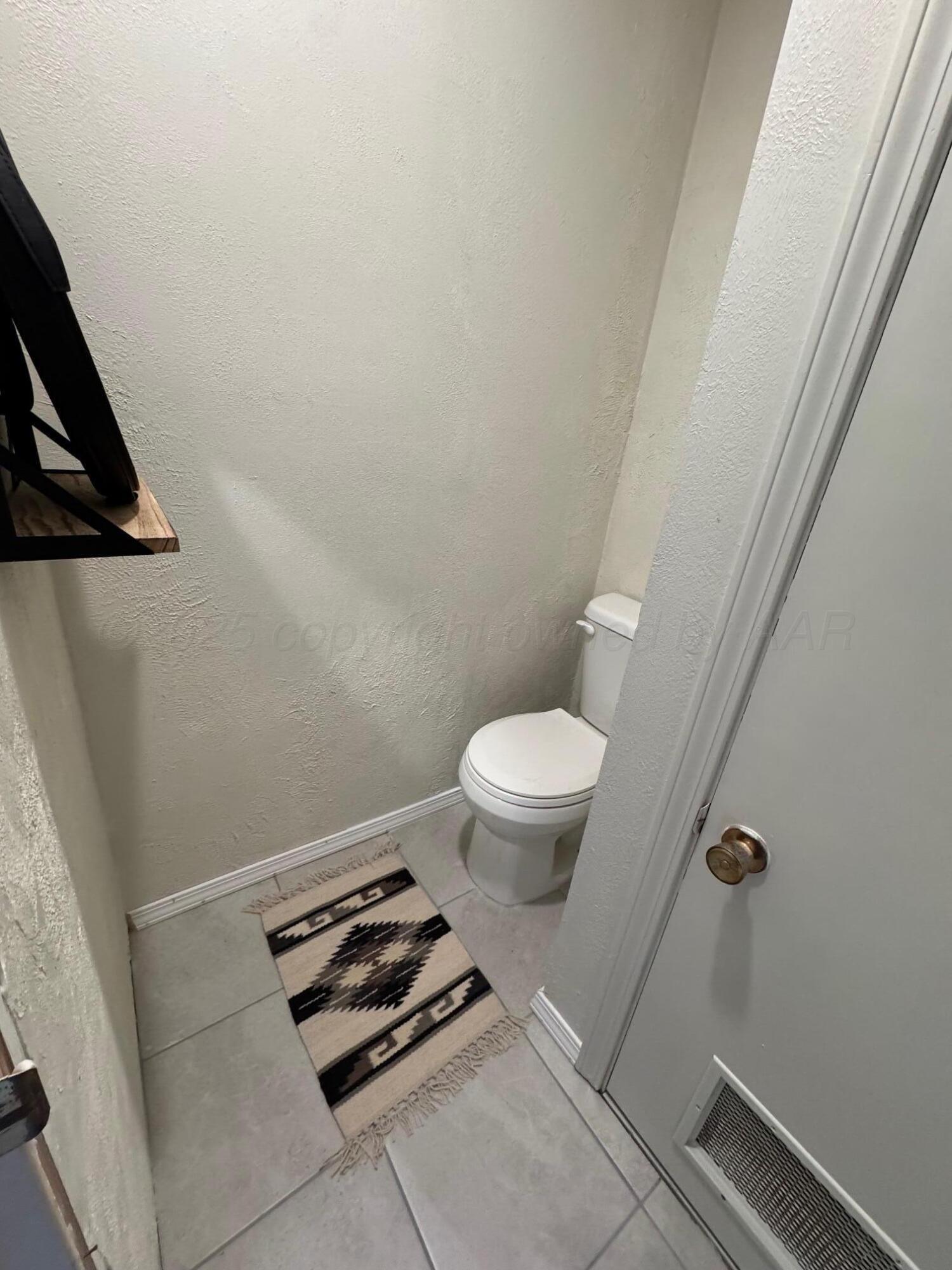 513 South Eton Street Perryton, TX 79070 - Photo 56 of 72 a bathroom with a sink and toilet