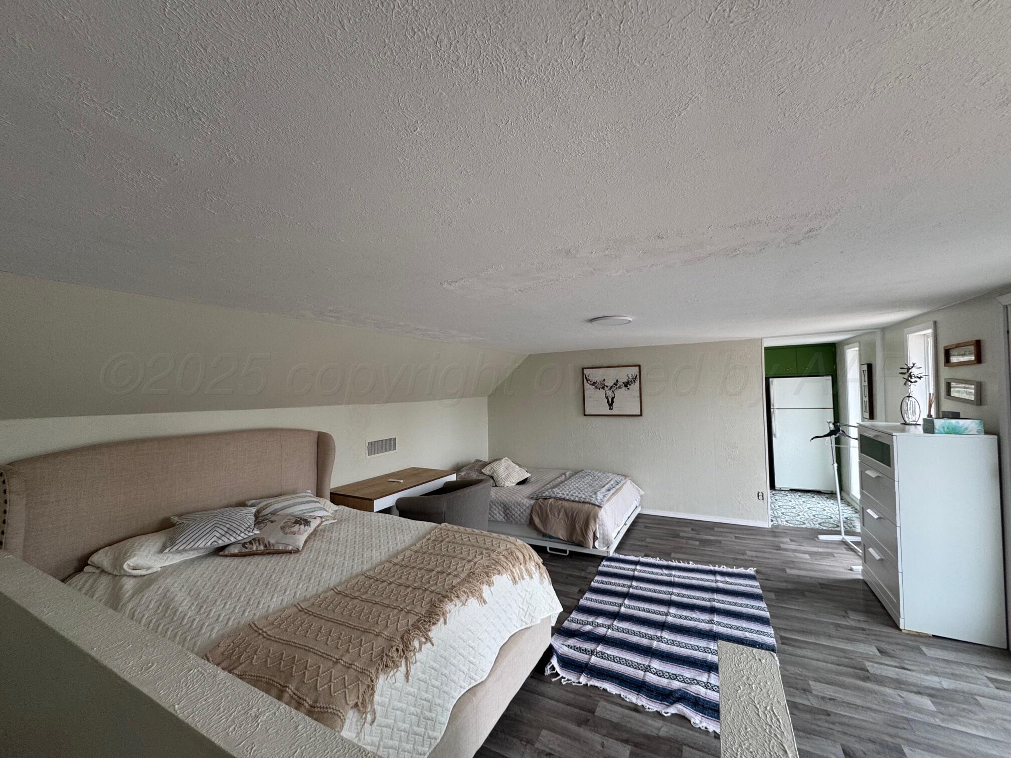 513 South Eton Street Perryton, TX 79070 - Photo 67 of 72 a bedroom with bed and window
