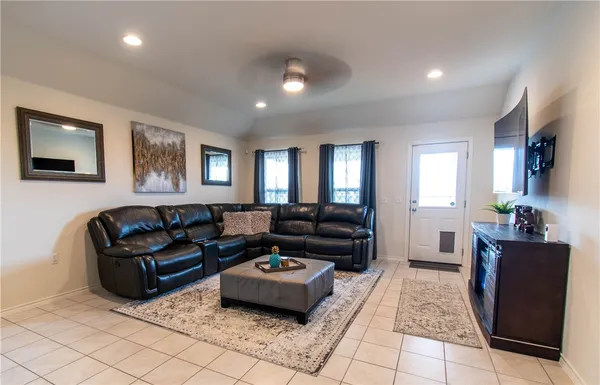 a living room with furniture rug and window