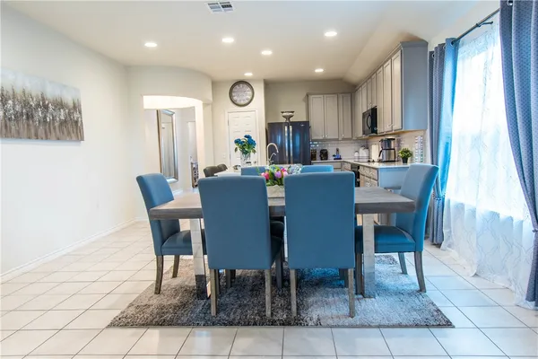 a bedroom with a bed and a ceiling fan