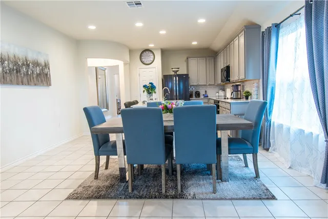 a bedroom with a bed and a ceiling fan