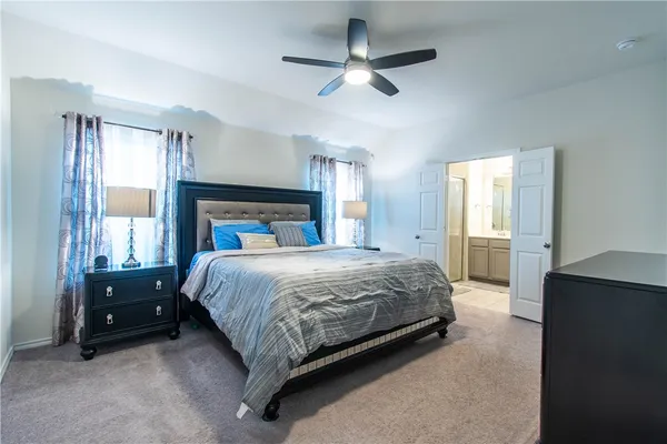 a bathroom with a sink a mirror and a shower