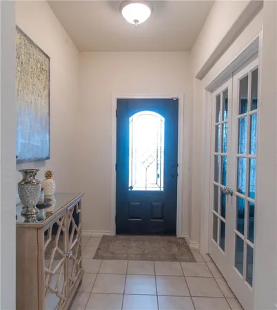 a room that has a lot of cabinets and a window