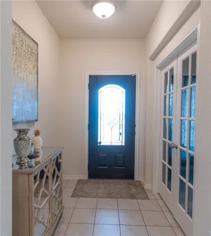 a room that has a lot of cabinets and a window