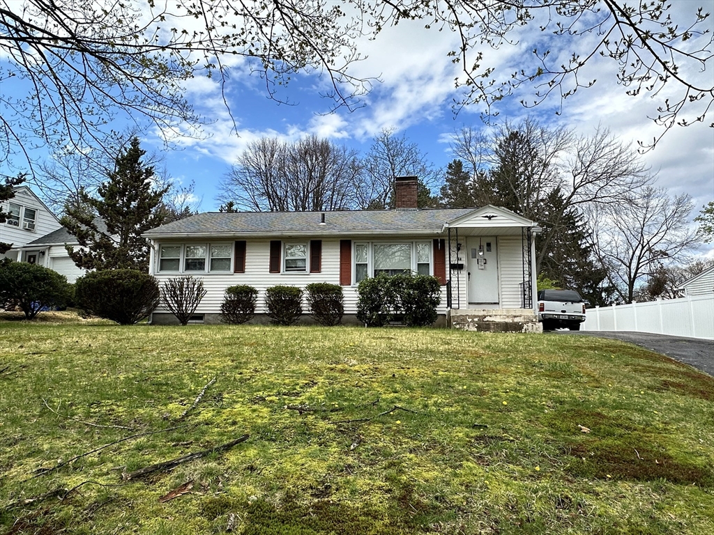 32 Brittany Road Springfield, MA 01151 - Photo 1 of 18 a front view of a house with a garden
