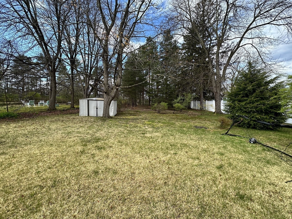 32 Brittany Road Springfield, MA 01151 - Photo 5 of 18 a view of a backyard with large trees