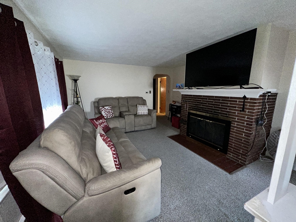 32 Brittany Road Springfield, MA 01151 - Photo 8 of 18 a living room with furniture and a flat screen tv