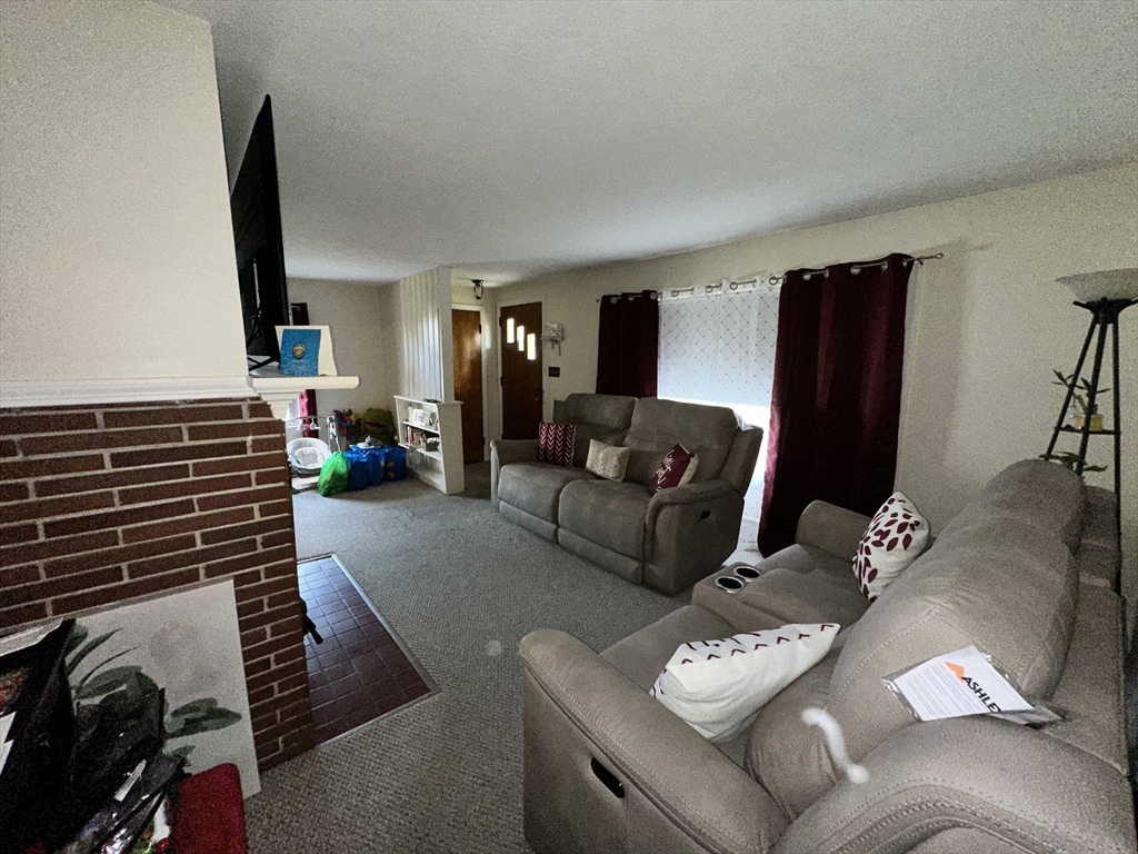 32 Brittany Road Springfield, MA 01151 - Photo 9 of 18 a living room with furniture and a flat screen tv