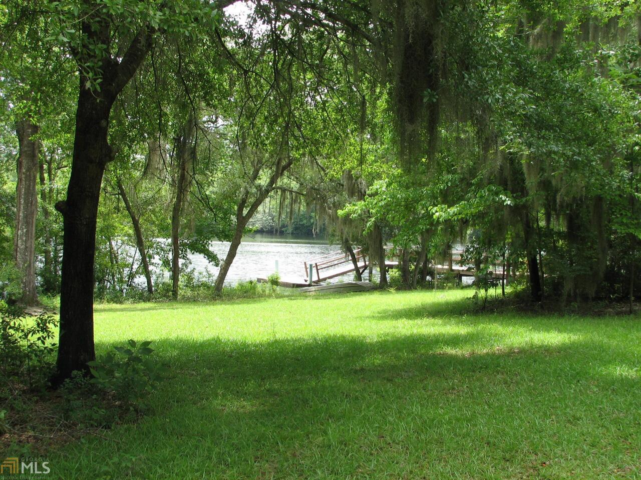 1382 Martin Road Pembroke, GA 31321 - Photo 1 of 1 a view of a park with large trees