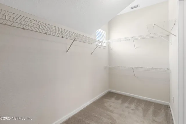 a view of a patio with a table and chairs
