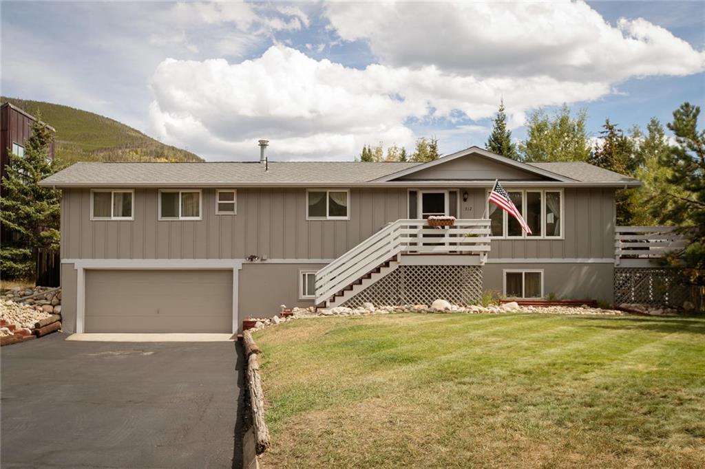 312 Alpine Road Dillon, CO 80435 - Photo 22 of 25 a front view of a house with a yard