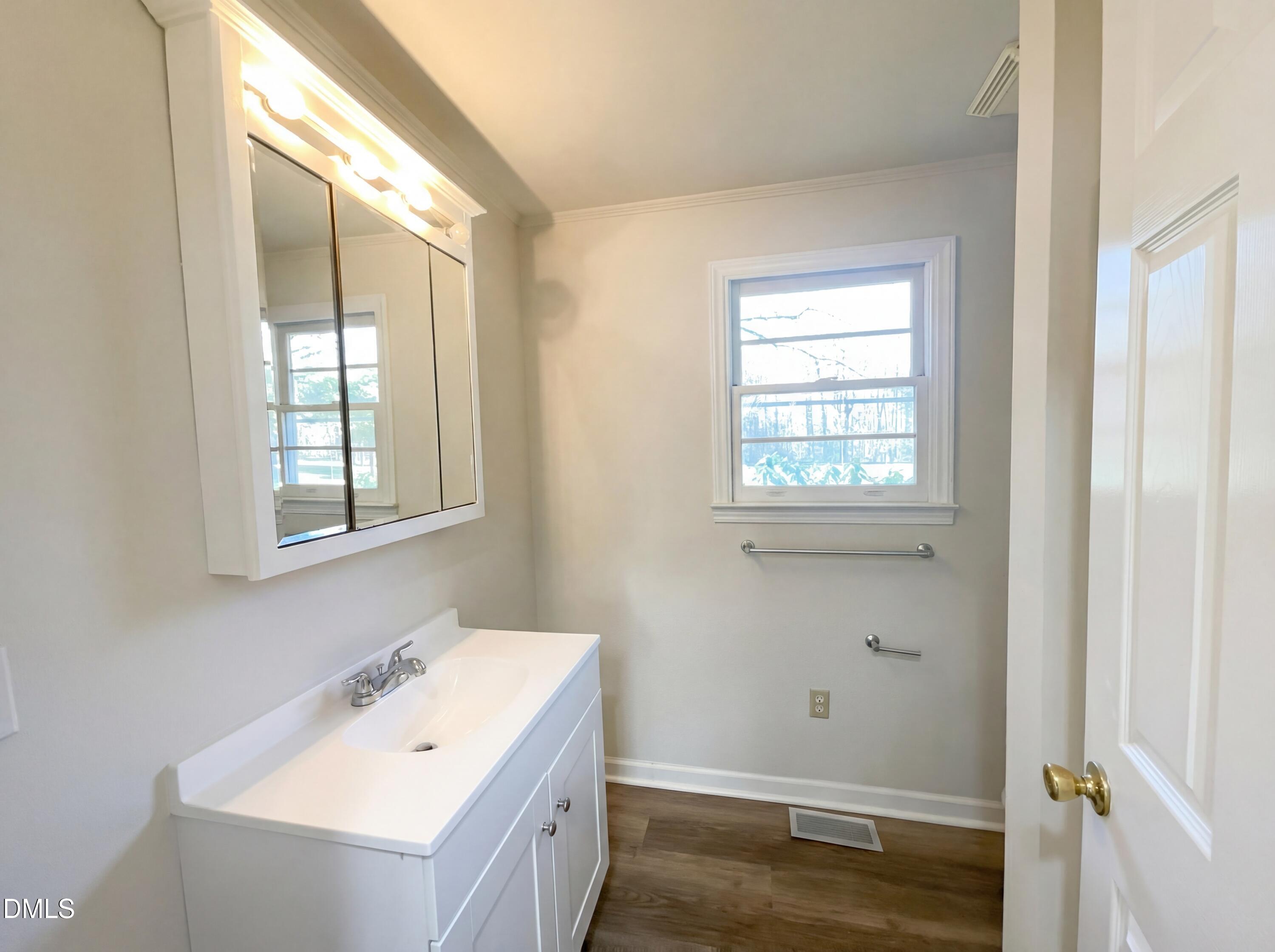 9815 Berry Road Timberlake, NC 27583 - Photo 12 of 17 a bathroom with a sink and a window
