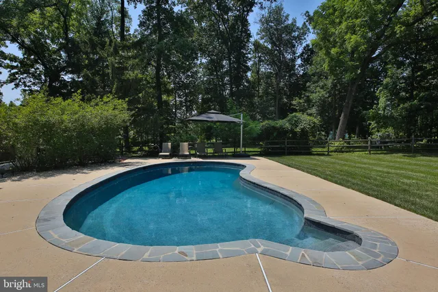 a view of a swimming pool with a patio