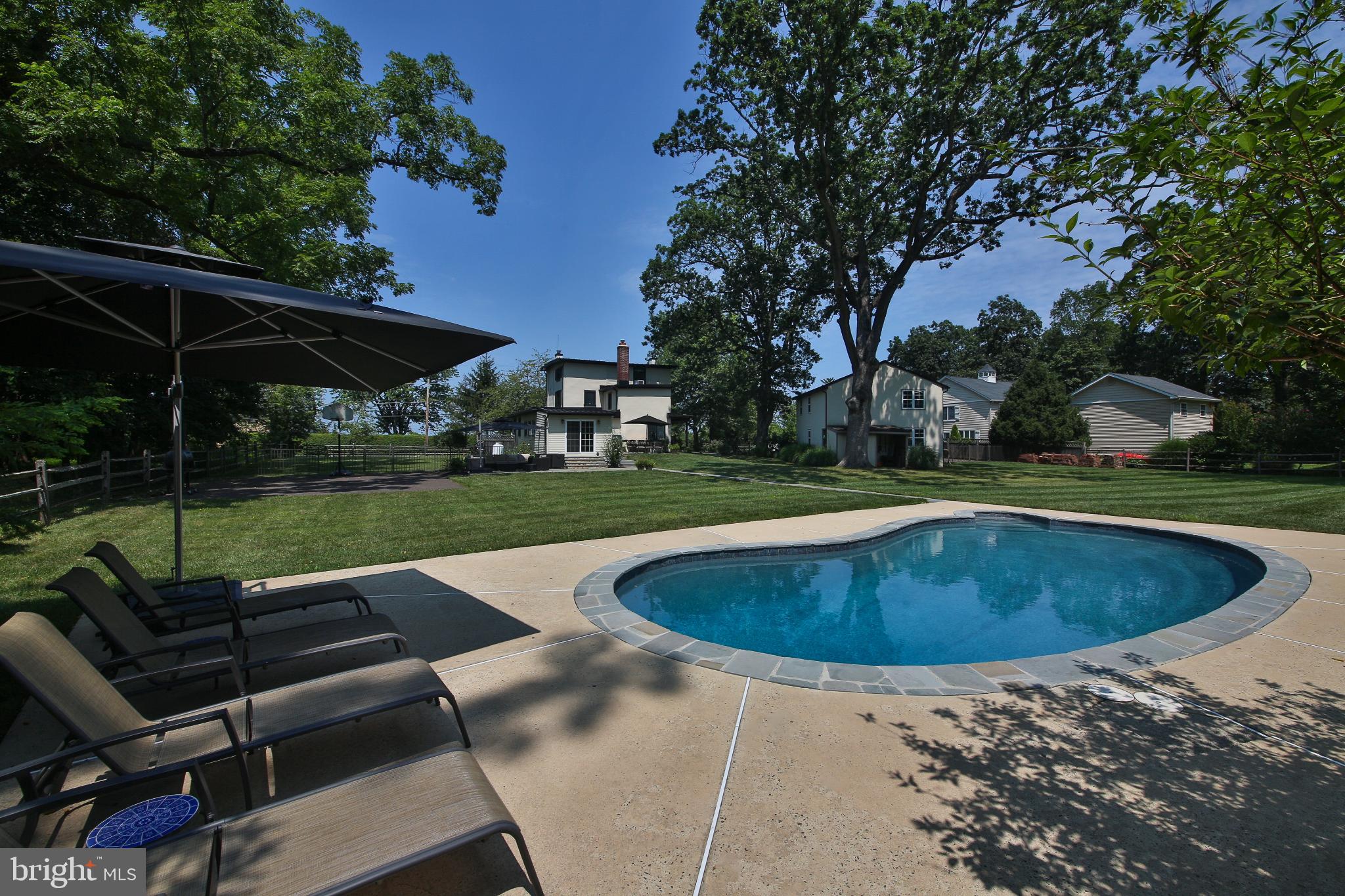 4964 Point Pleasant Pike Doylestown, PA 18902 - Photo 26 of 28 Serene backyard oasis with inviting pool.