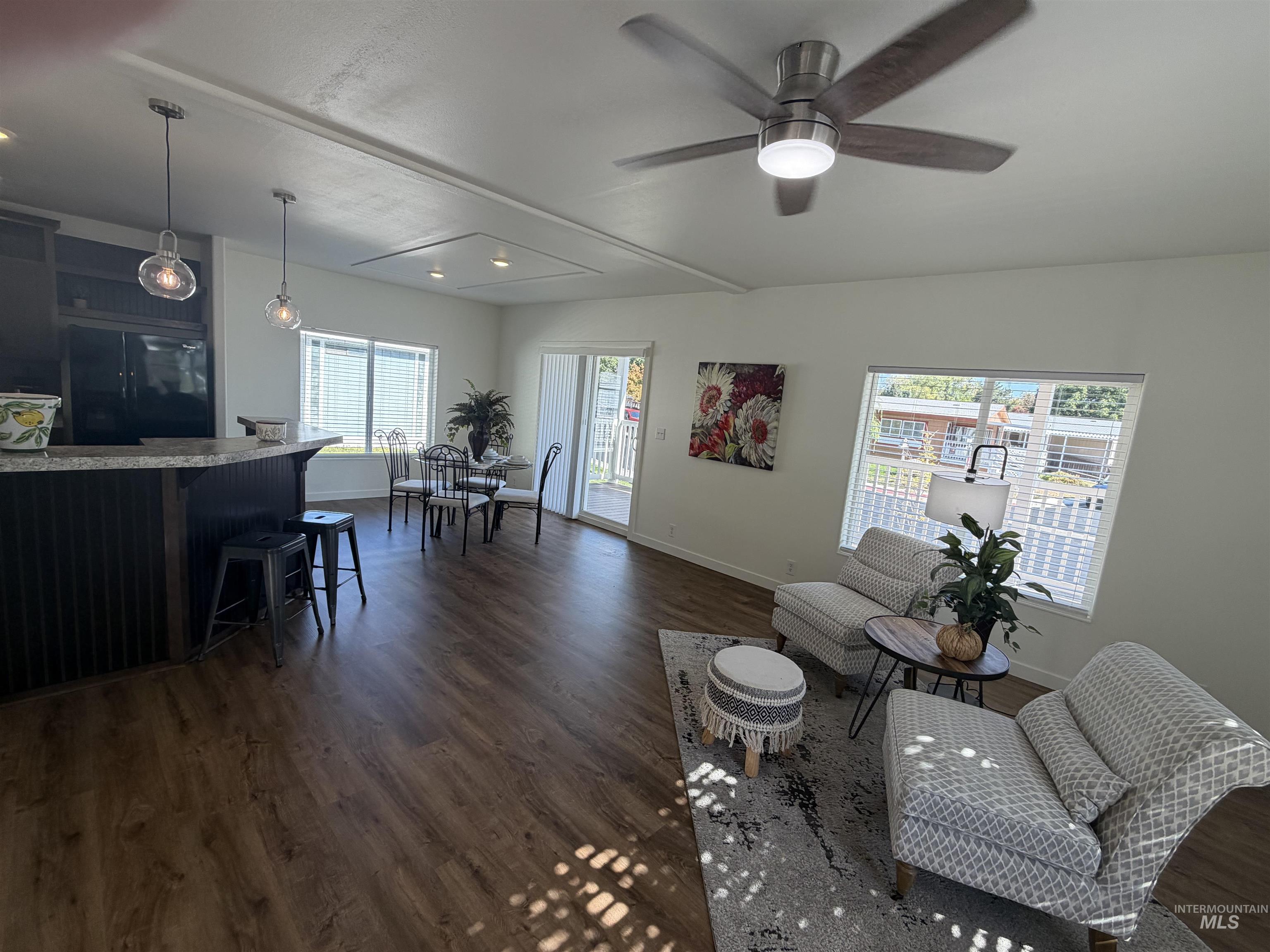 611 North Timathy Road Boise, ID 83713 - Photo 9 of 28 Wood-finish flooring throughout, complemented by a ceiling fan with integrated lighting