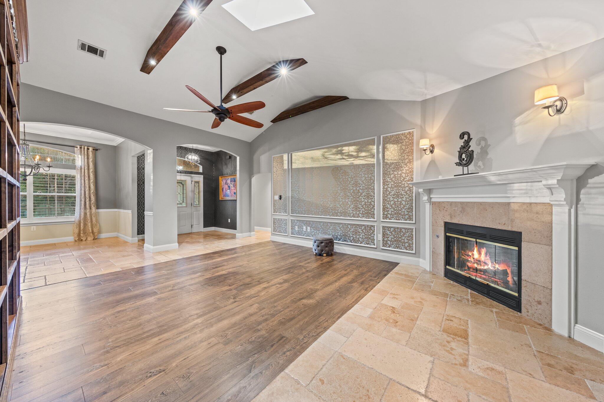 1825 Huntington Road Niceville, FL 32578 - Photo 19 of 68 a view of a livingroom with a fireplace a ceiling fan and windows