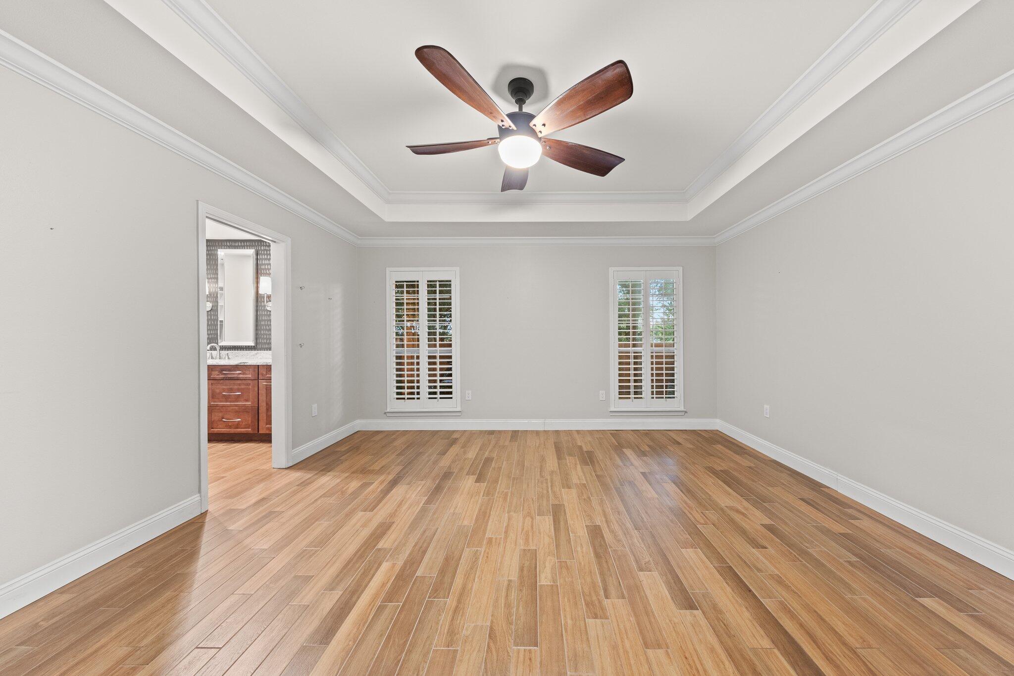 1825 Huntington Road Niceville, FL 32578 - Photo 30 of 68 a view of an empty room with wooden floor and a window