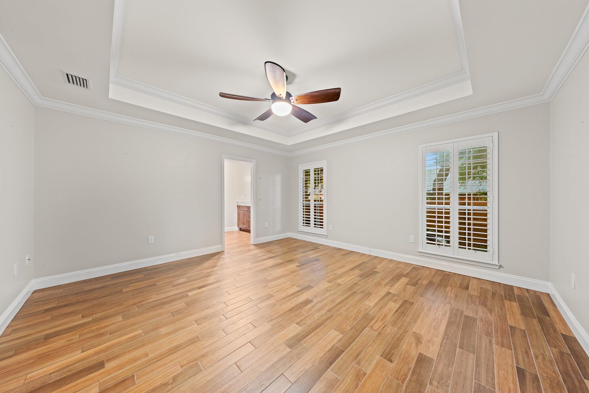 1825 Huntington Road Niceville, FL 32578 - Photo 31 of 68 a view of an empty room with wooden floor and a window
