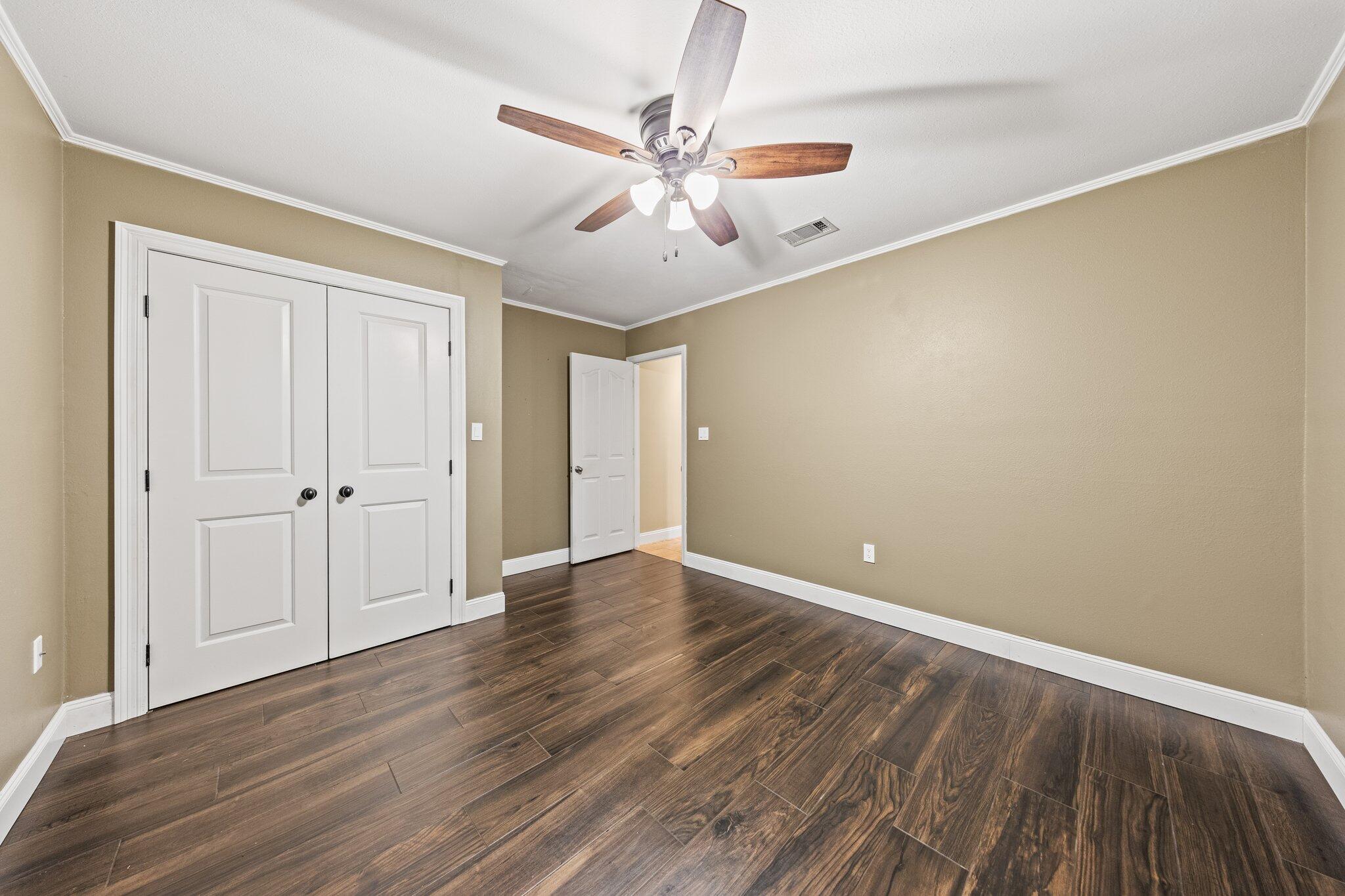 1825 Huntington Road Niceville, FL 32578 - Photo 40 of 68 a view of an empty room with wooden floor