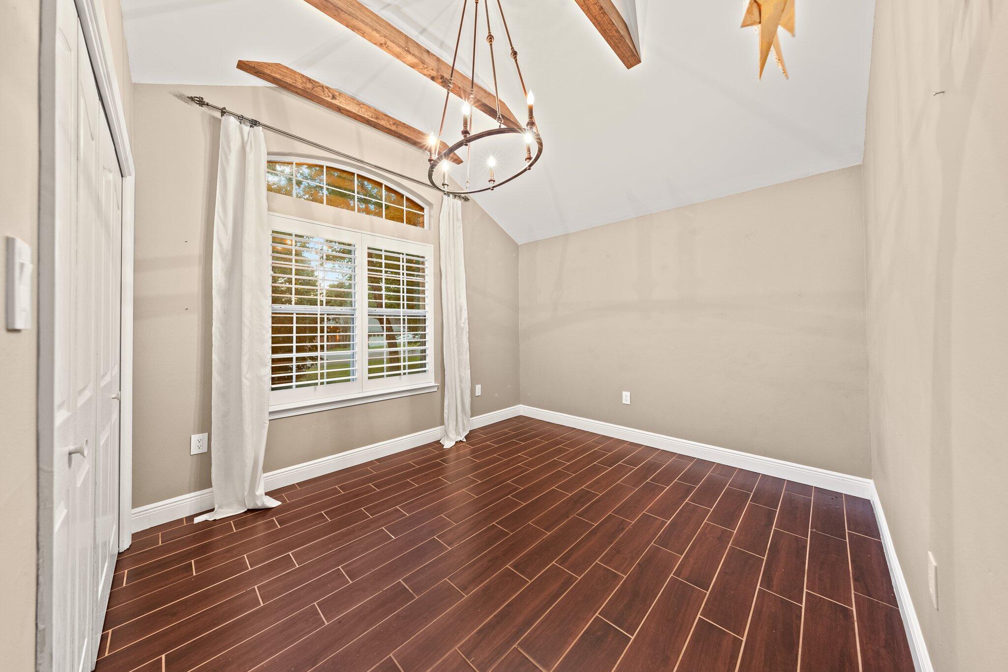 1825 Huntington Road Niceville, FL 32578 - Photo 41 of 68 a view of an empty room with wooden floor and a window