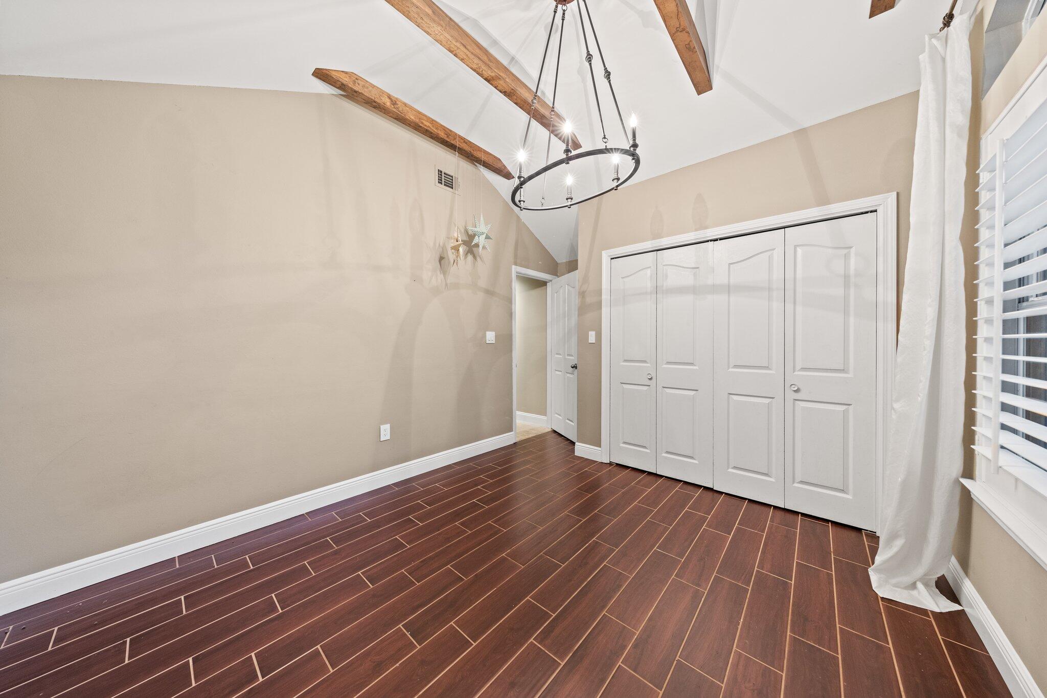 1825 Huntington Road Niceville, FL 32578 - Photo 42 of 68 a view of a room with wooden floor and white walls