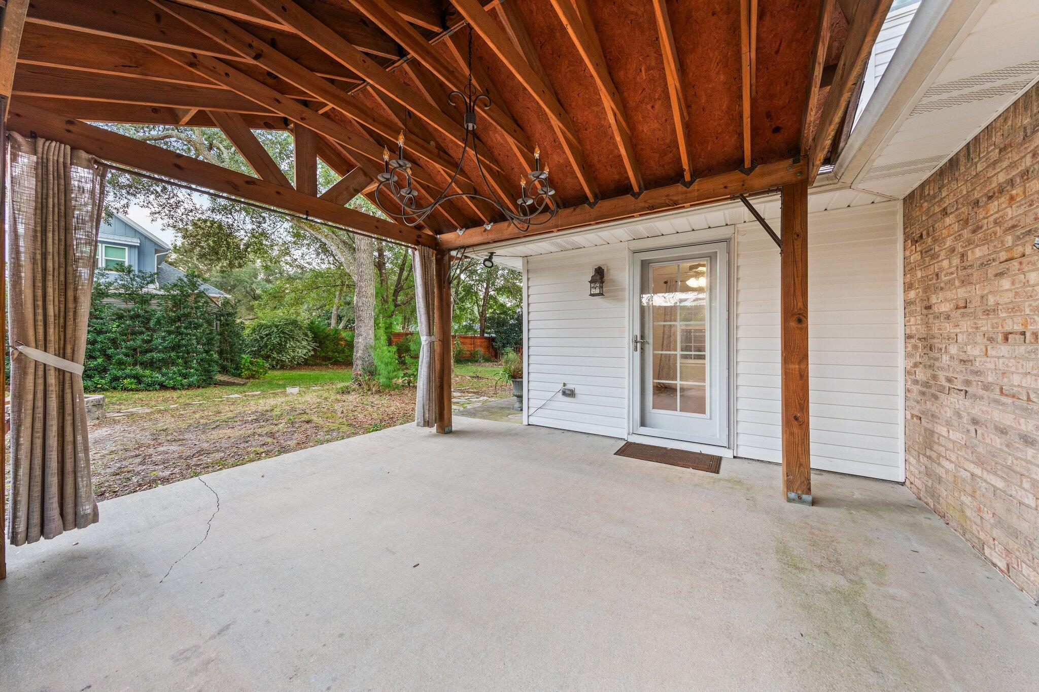 1825 Huntington Road Niceville, FL 32578 - Photo 49 of 68 a view of a room with wooden walls and iron stairs