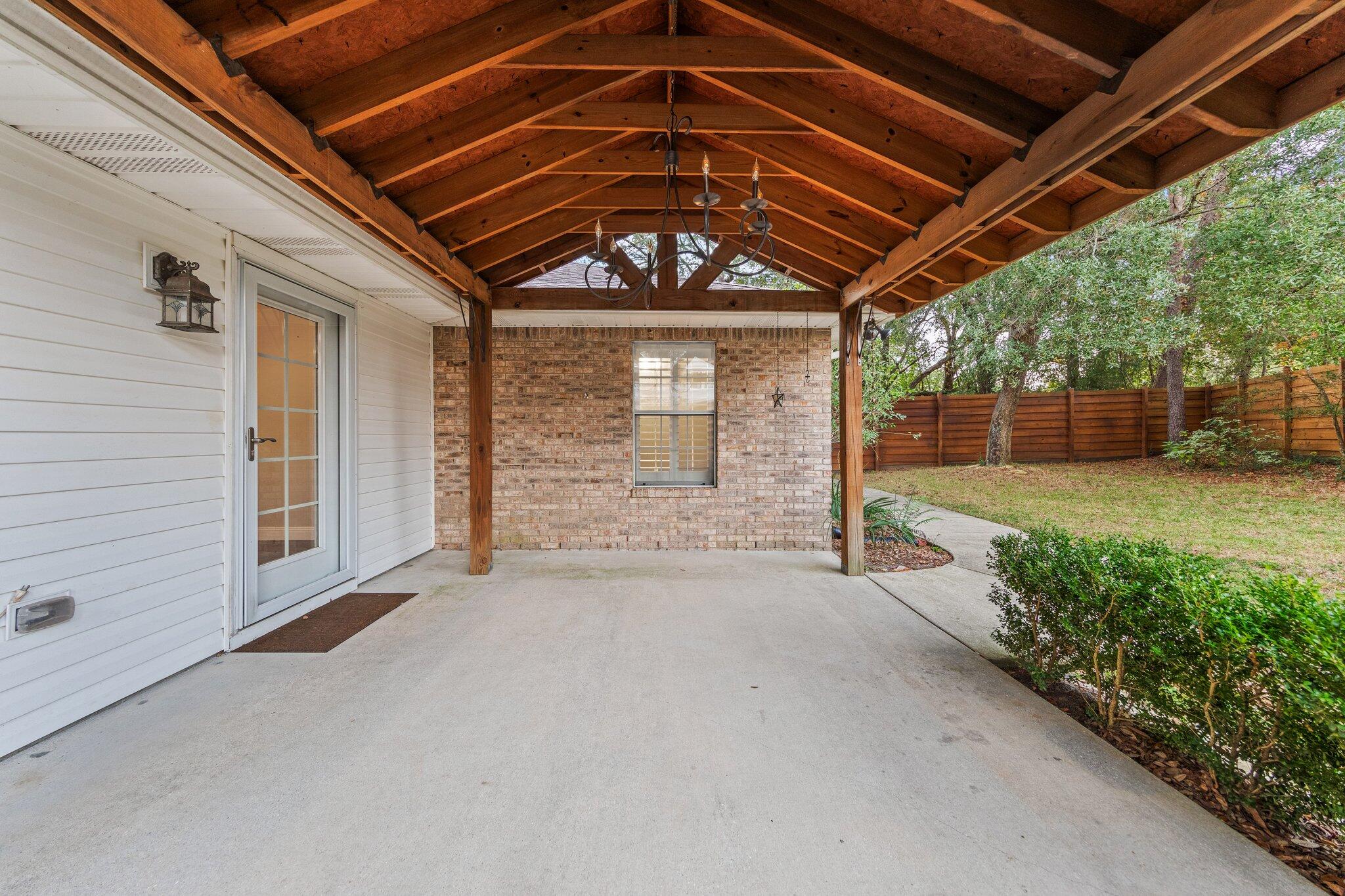 1825 Huntington Road Niceville, FL 32578 - Photo 50 of 68 a view of a porch with a backyard