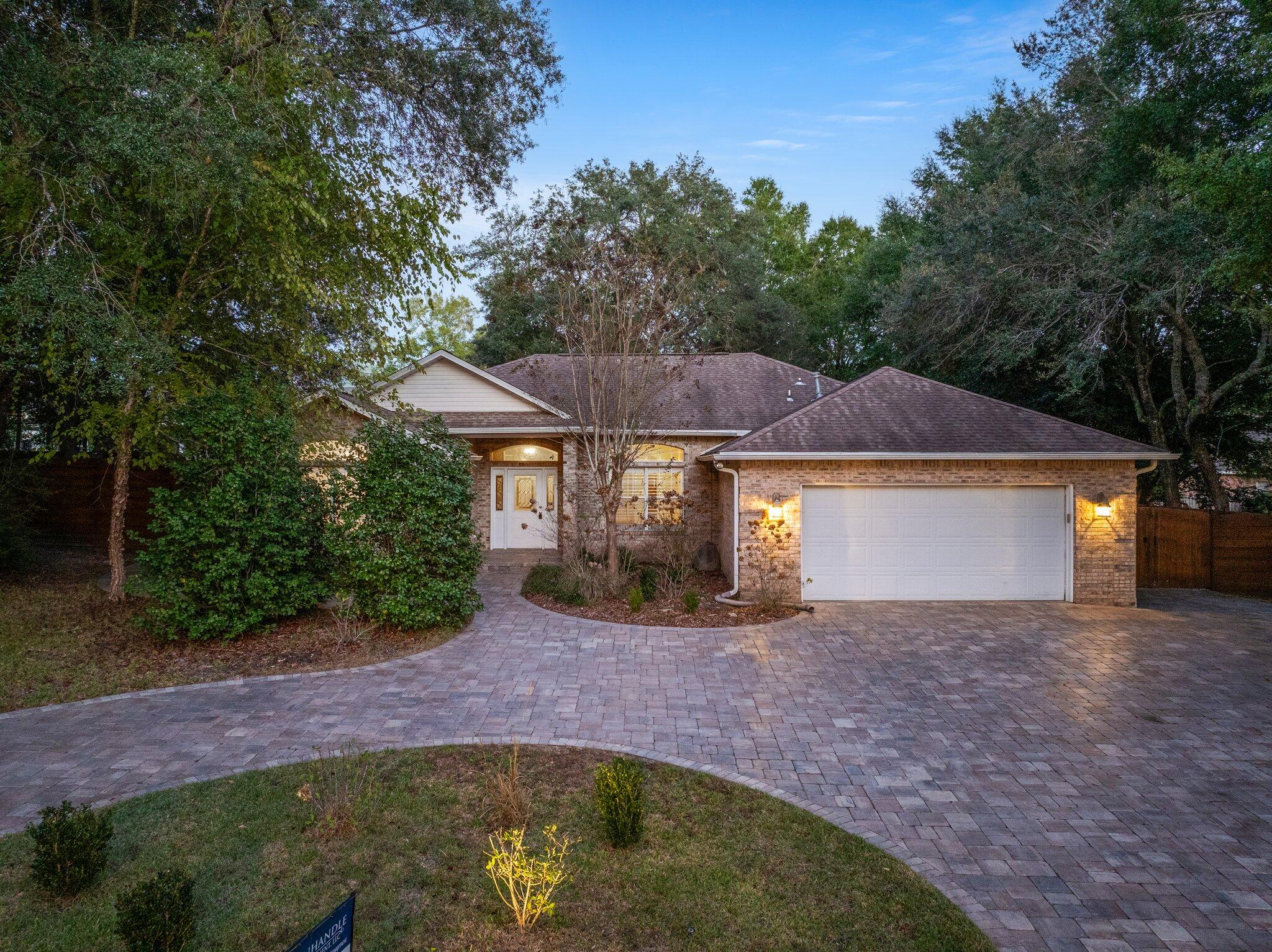 1825 Huntington Road Niceville, FL 32578 - Photo 8 of 68 a view of a house with a yard plants and large tree