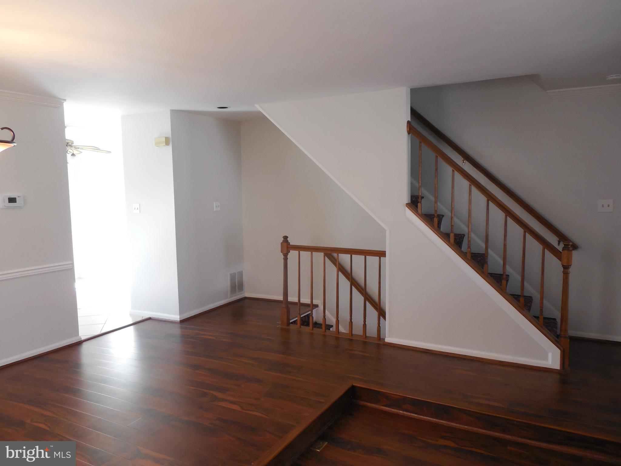 14930 Habersham Circle Silver Spring, MD 20906 - Photo 7 of 26 grand stair lead to dining living area.