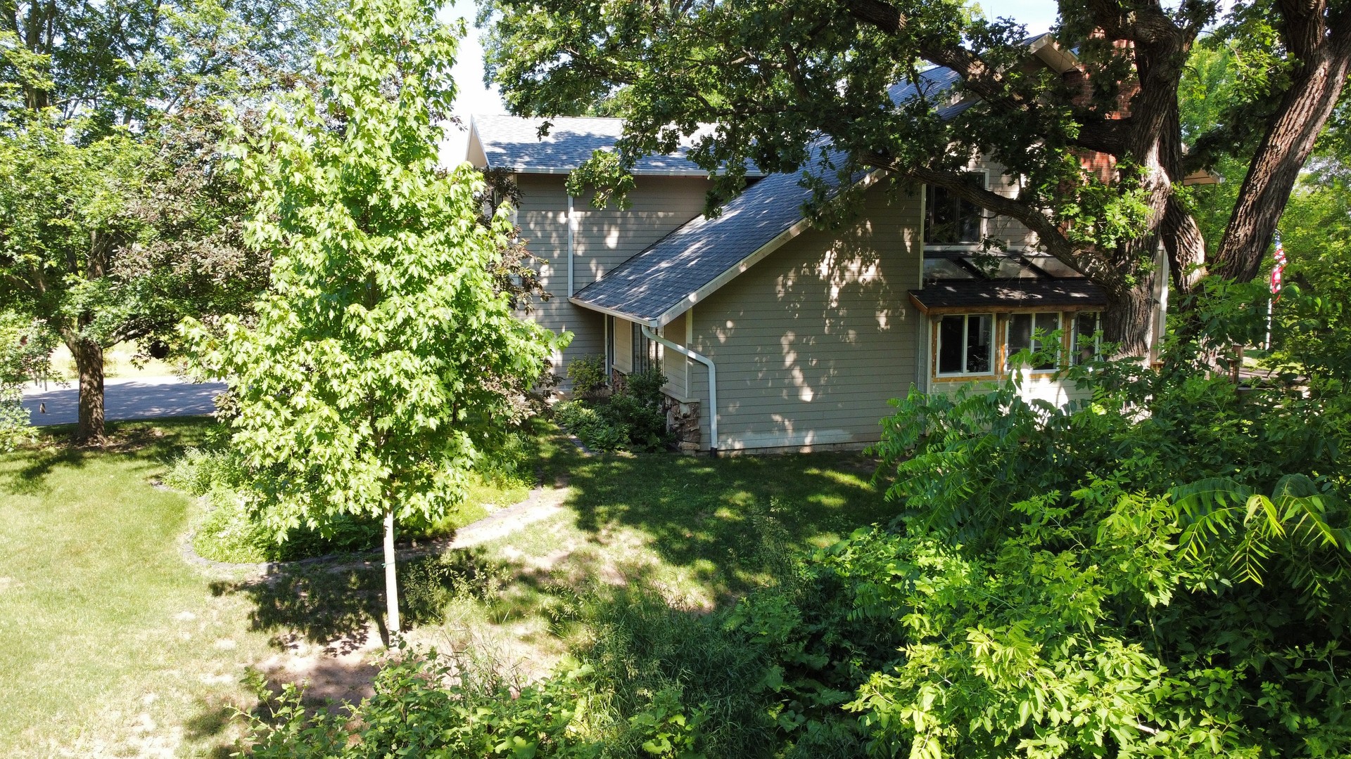 3814 May Lane Spring Grove, IL 60081 - Photo 12 of 18 a view of a house in a forest