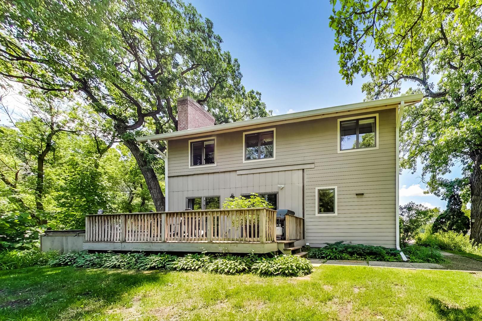 3814 May Lane Spring Grove, IL 60081 - Photo 2 of 18 a view of a backyard with plants and large tree
