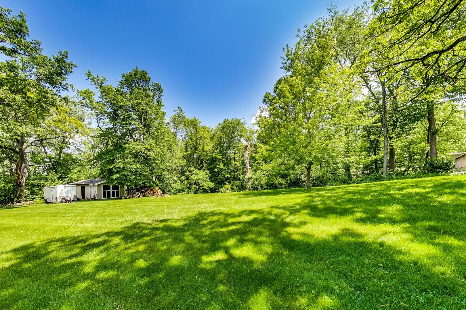 3814 May Lane Spring Grove, IL 60081 - Photo 5 of 18 a view of green field with trees in the background