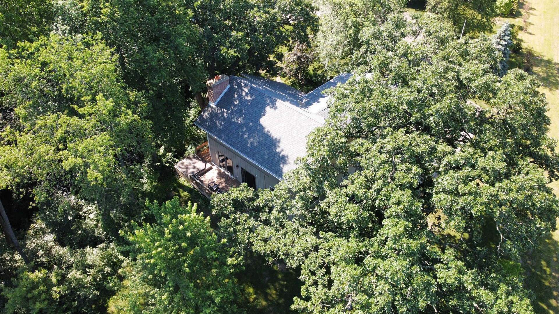 3814 May Lane Spring Grove, IL 60081 - Photo 10 of 18 an aerial view of a house with a yard and large trees