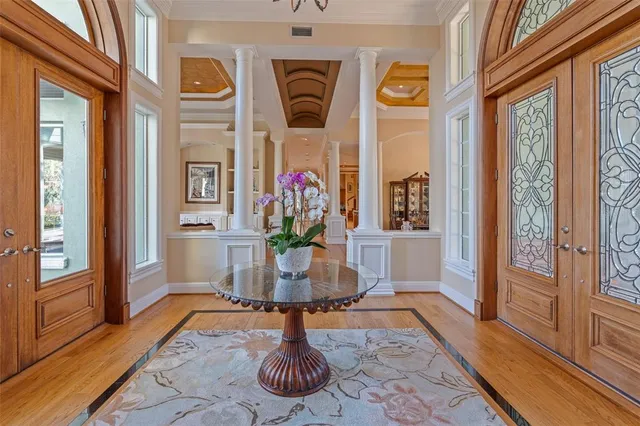 a dining room with furniture and wooden floor