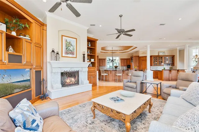 a living room with furniture a fireplace and a table