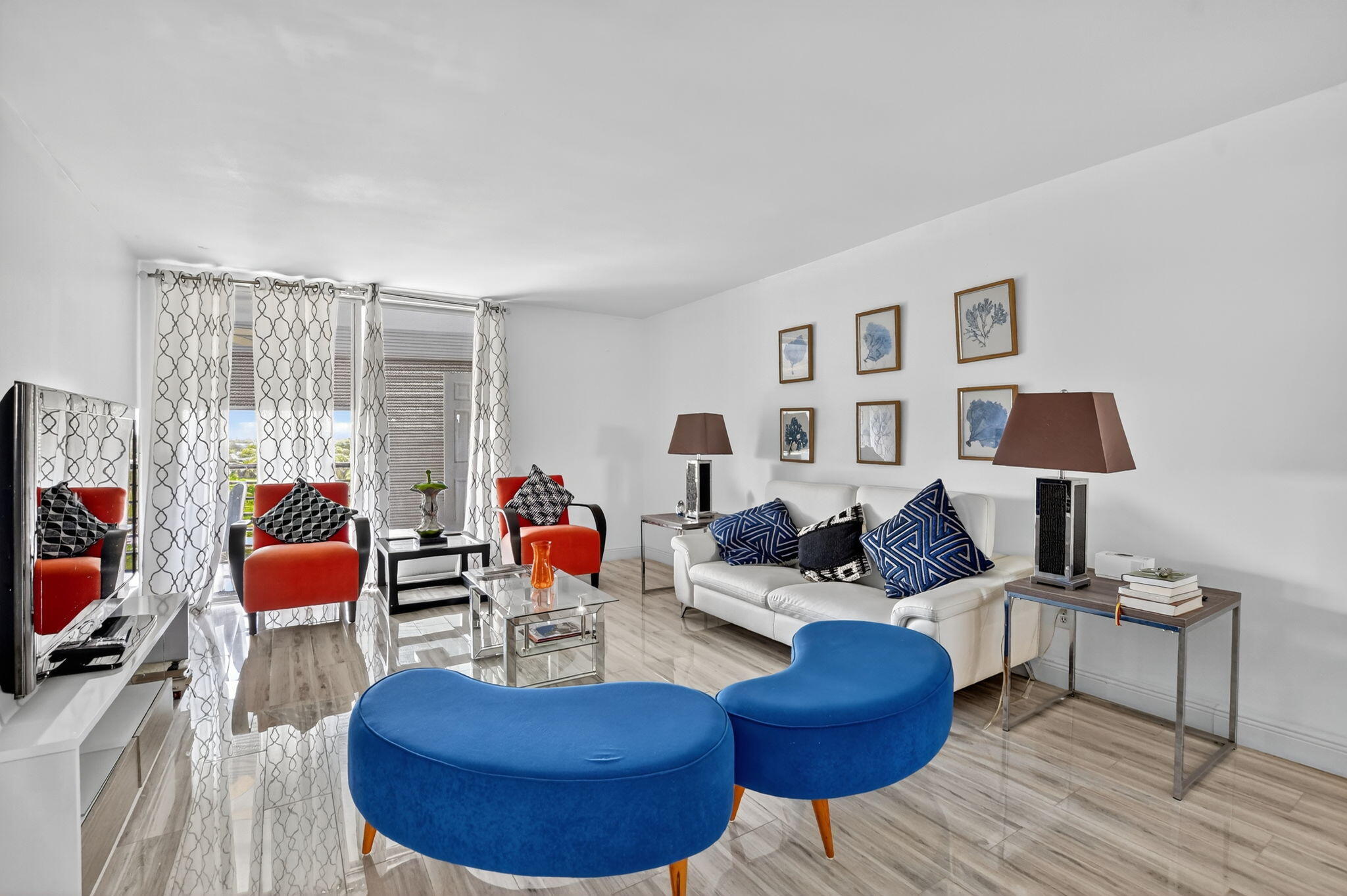 23277 Barwood Lane North, Unit 403 Boca Raton, FL 33428 - Photo 13 of 30 a living room with furniture and a flat screen tv