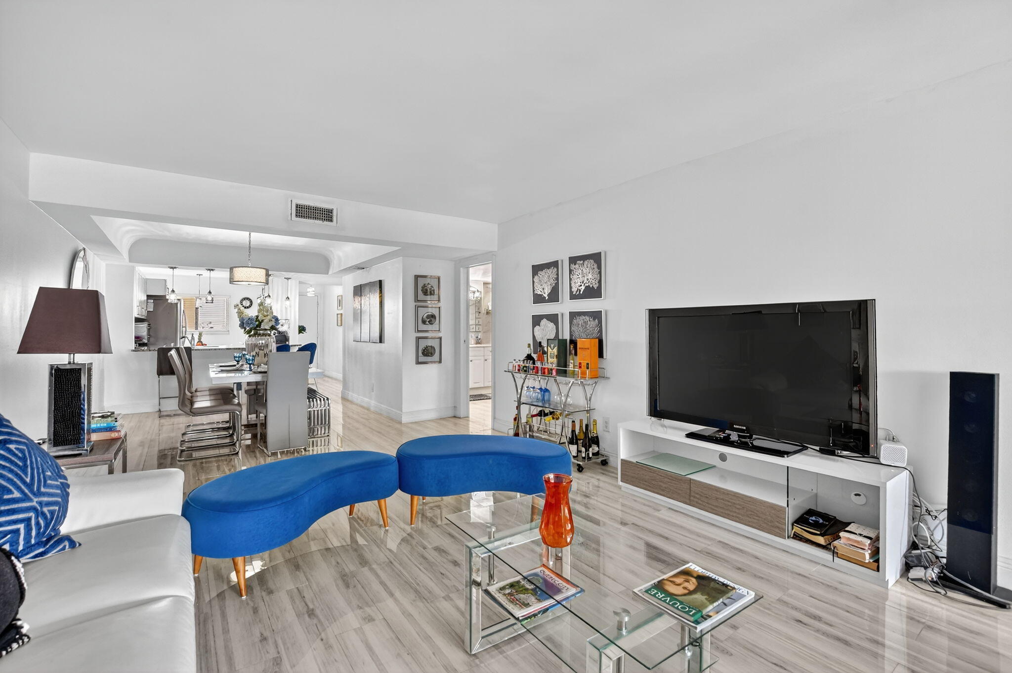 23277 Barwood Lane North, Unit 403 Boca Raton, FL 33428 - Photo 15 of 30 a living room with furniture and a flat screen tv