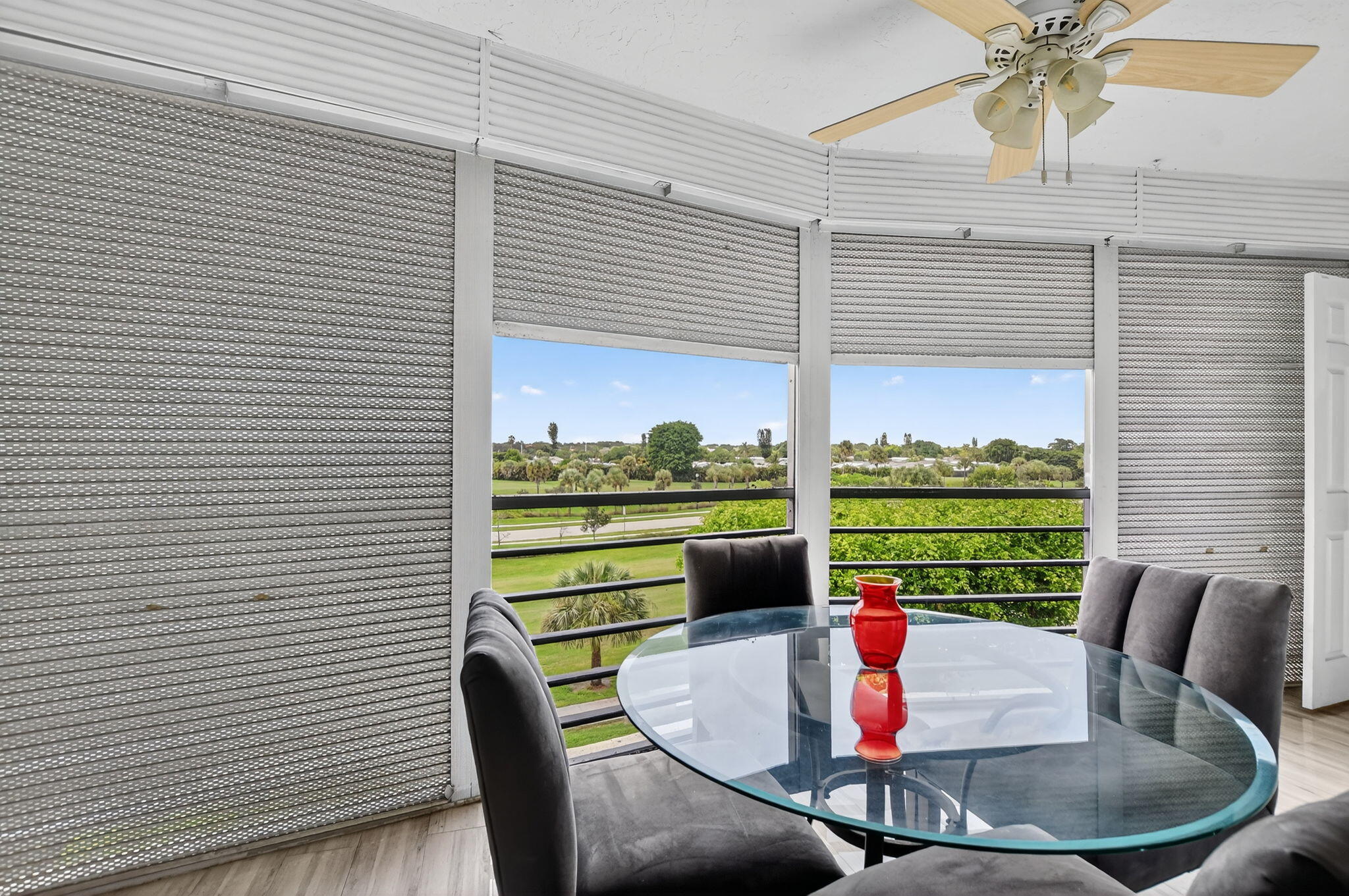 23277 Barwood Lane North, Unit 403 Boca Raton, FL 33428 - Photo 22 of 30 a dining room with furniture and a floor to ceiling window