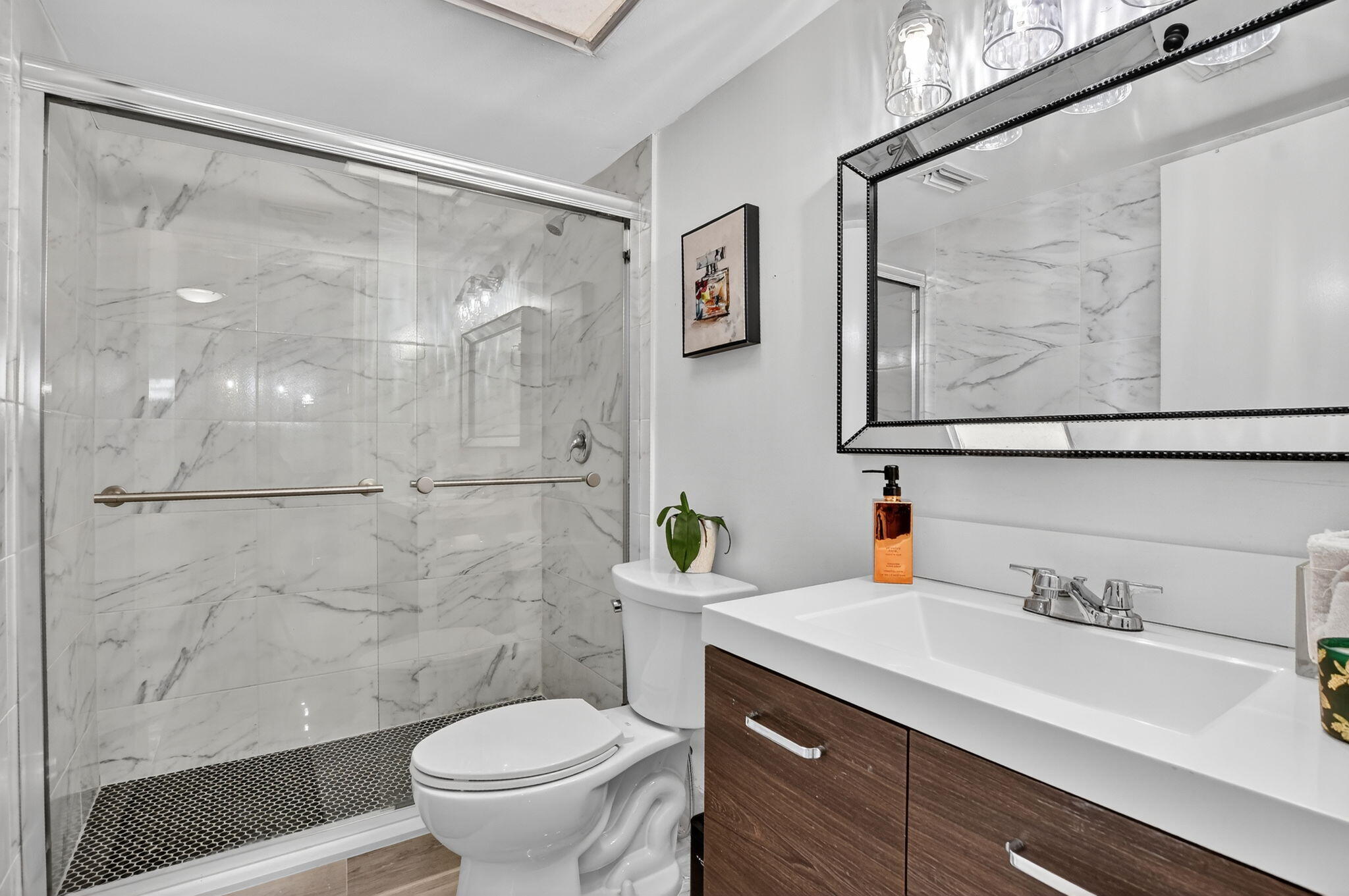 23277 Barwood Lane North, Unit 403 Boca Raton, FL 33428 - Photo 7 of 30 a bathroom with a granite countertop sink toilet and shower