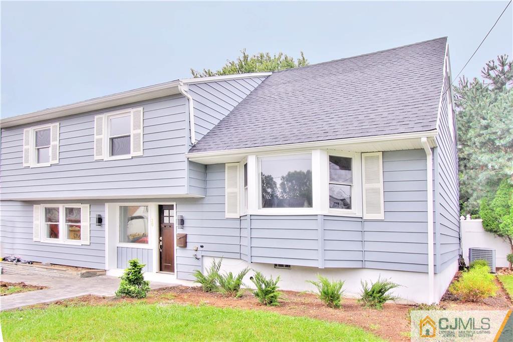 20 Phillips Road Edison, NJ 08817 - Photo 1 of 19 a front view of a house with a yard and outdoor seating