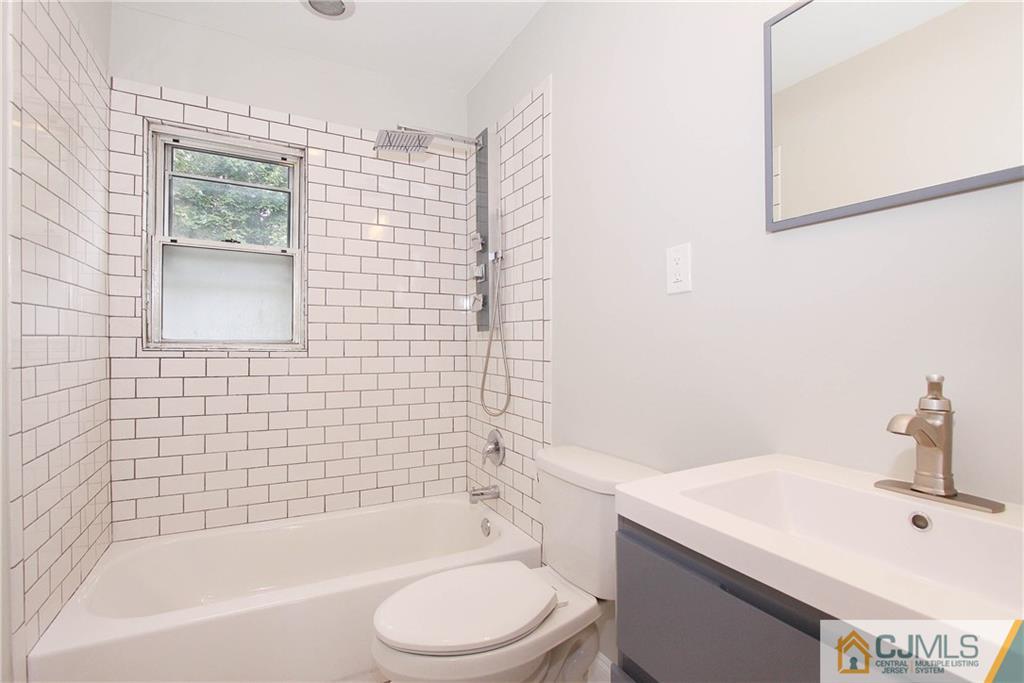 20 Phillips Road Edison, NJ 08817 - Photo 16 of 19 a bathroom with a sink a toilet and shower
