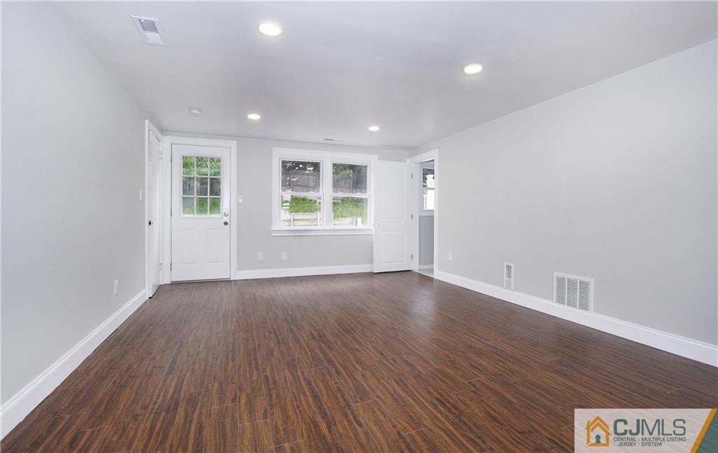 20 Phillips Road Edison, NJ 08817 - Photo 17 of 19 an empty room with wooden floor and windows