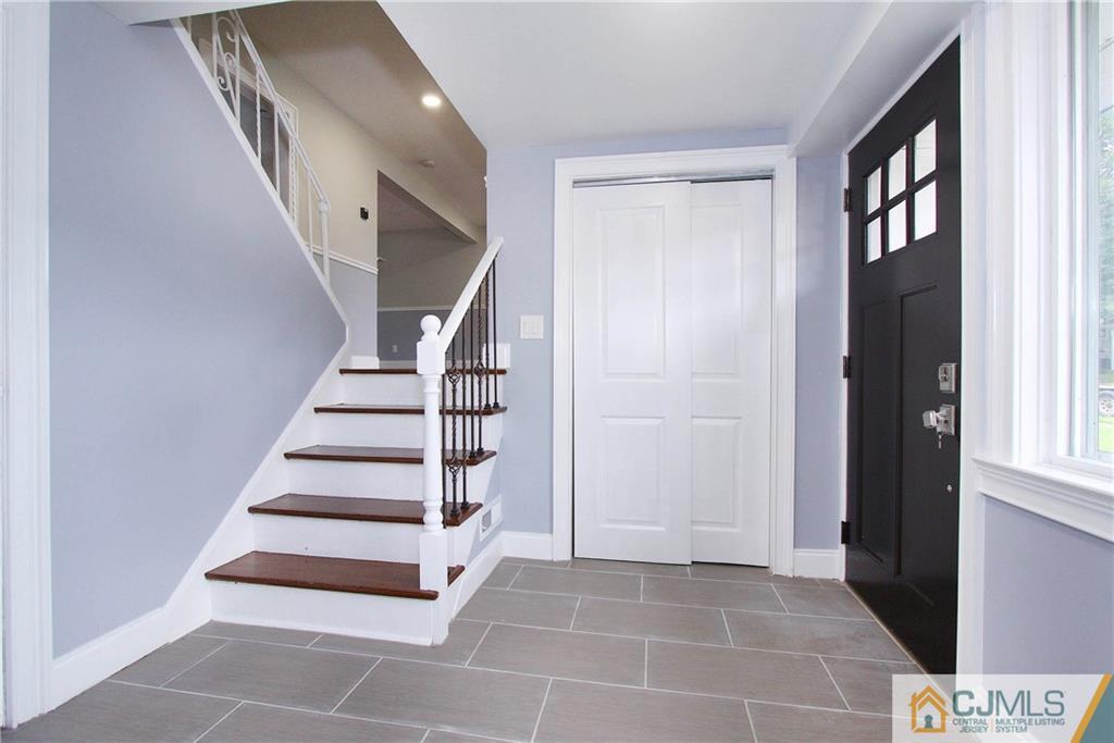 20 Phillips Road Edison, NJ 08817 - Photo 3 of 19 a view of entryway with hall and front door