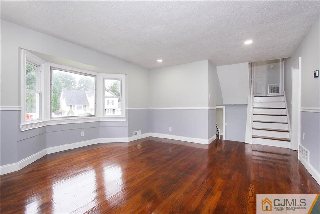 20 Phillips Road Edison, NJ 08817 - Photo 5 of 19 a view of empty room with wooden floor and window