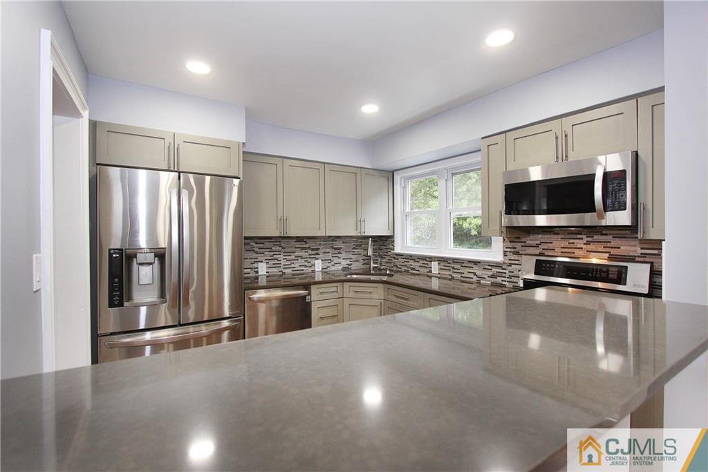 20 Phillips Road Edison, NJ 08817 - Photo 8 of 19 a large kitchen with a large window and stainless steel appliances