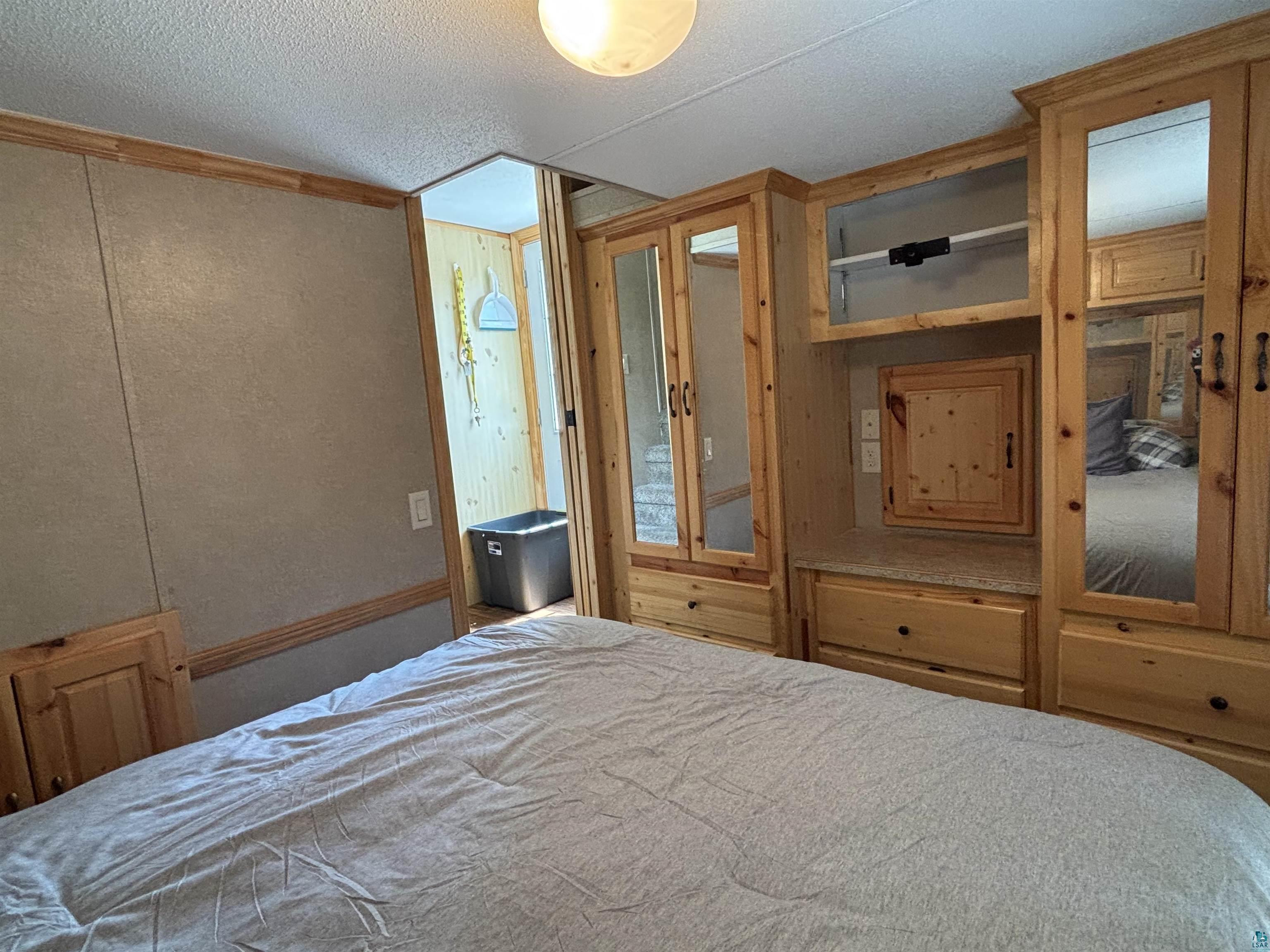 9442 Bear Ridge Drive Orr, MN 55771 - Photo 11 of 26 Bedroom featuring a textured ceiling