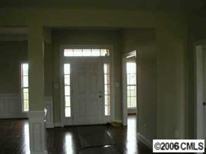 3104 East Lawyers Road Monroe, NC 28110 - Photo 2 of 7 a view of entryway and hall with wooden floor